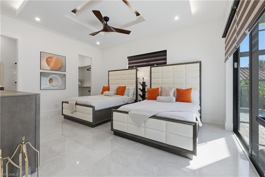 Bedroom with a ceiling fan and access to outside