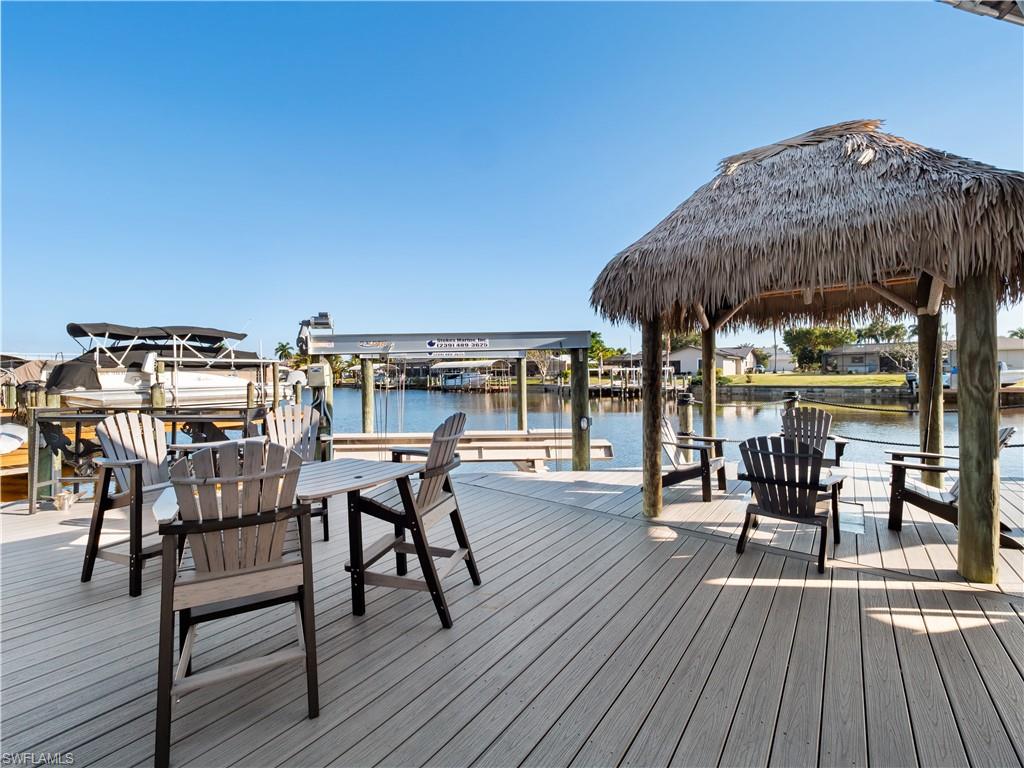 Dock area with boat lift and a water view