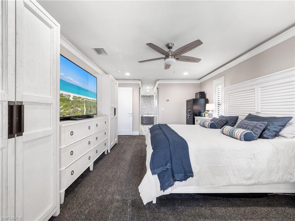 Bedroom featuring crown molding, a ceiling fan, dark colored carpet, and recessed lighting