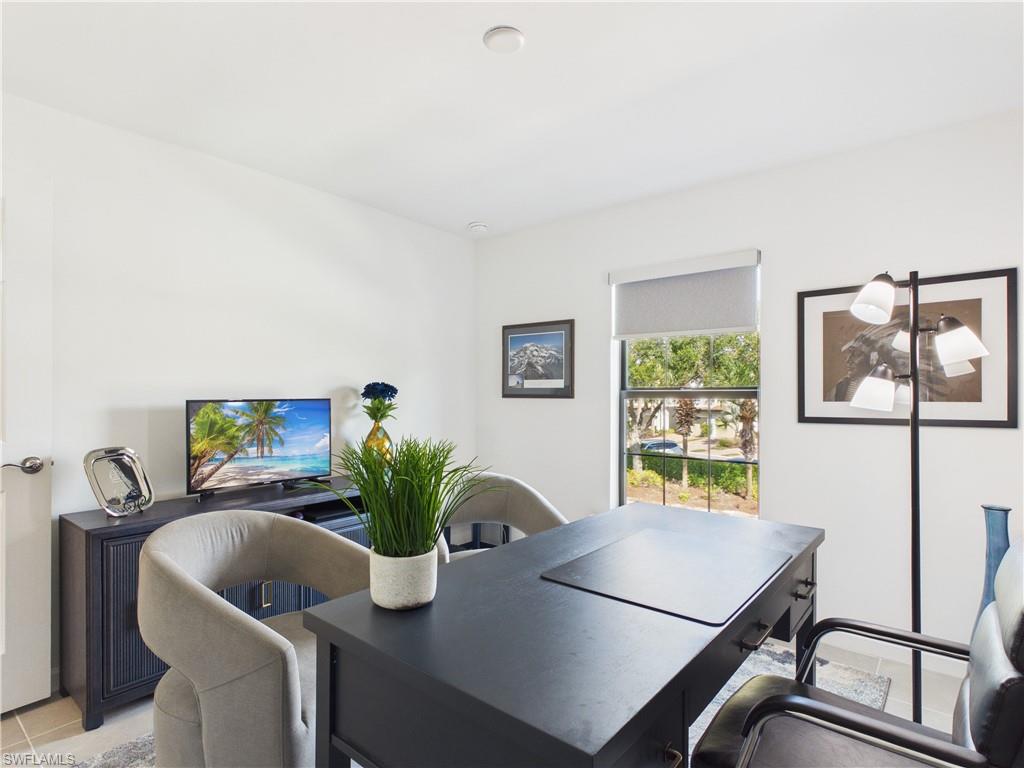 Office area featuring light tile patterned floors