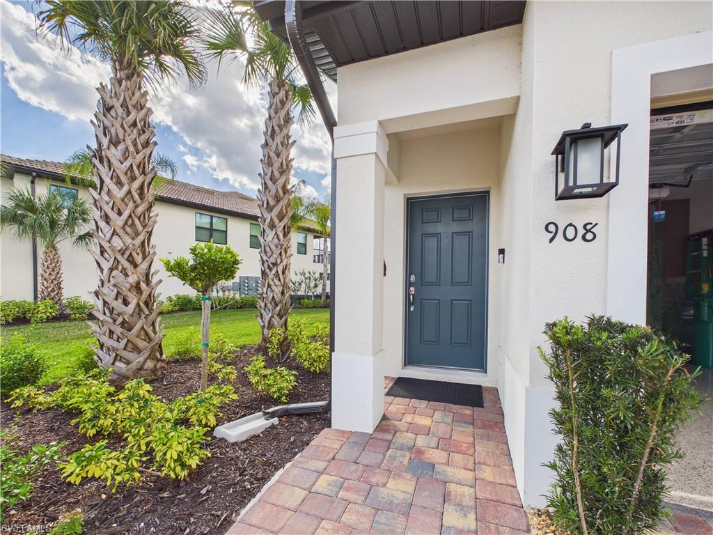 Doorway to property with stucco siding