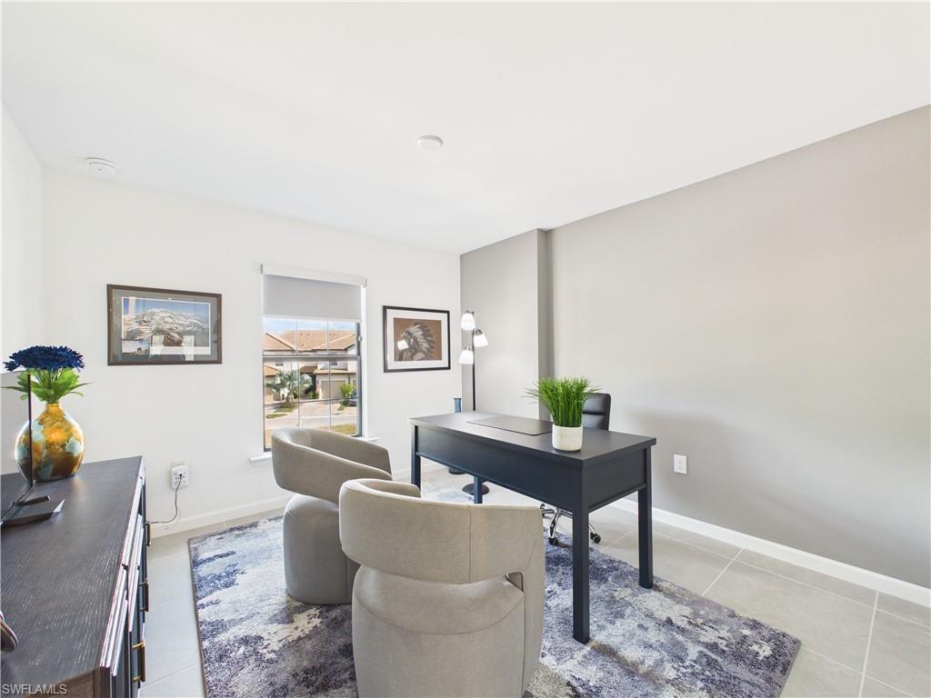Office area with baseboards and light tile patterned floors