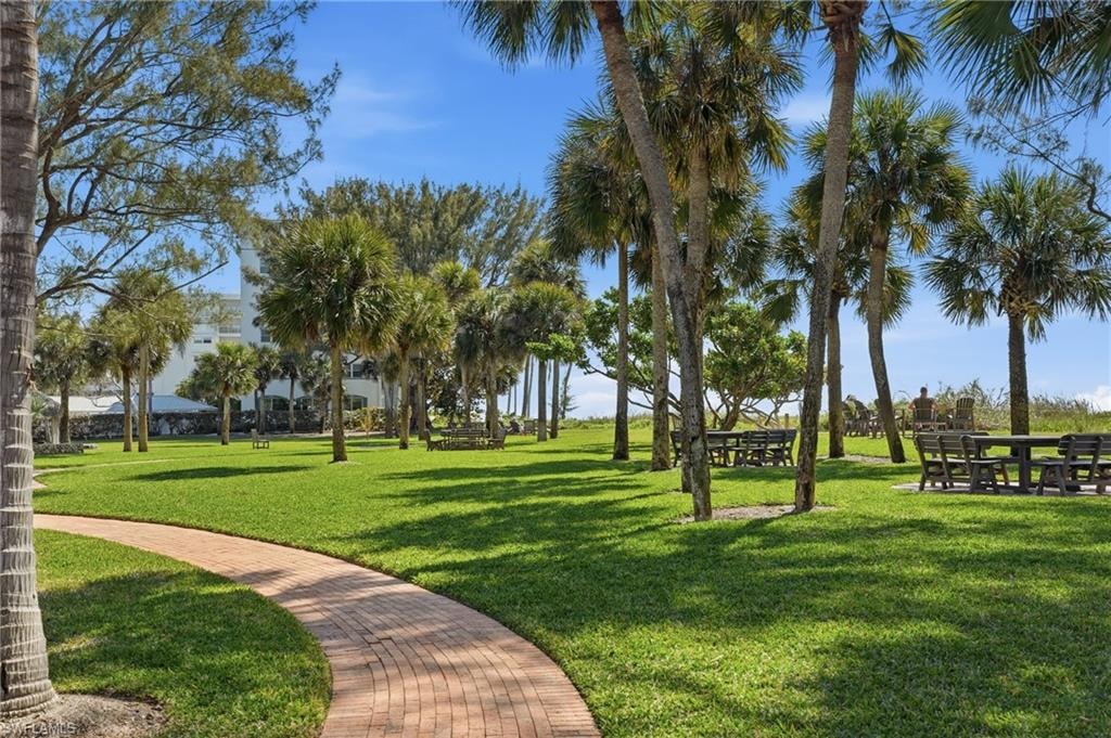 Private Moorings Beach Club includes covered Tiki dining, private beach access, bathrooms, green space with beautiful landscape and parking.
