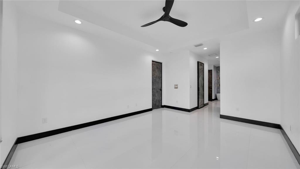 Unfurnished room with recessed lighting and a ceiling fan