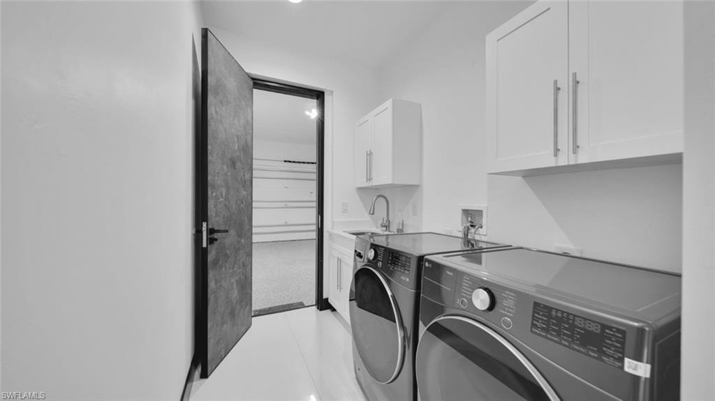 Laundry room with cabinet space and separate washer and dryer