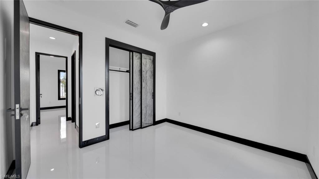 Unfurnished bedroom featuring recessed lighting, a closet, and ceiling fan