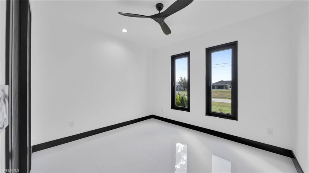 Spare room with ceiling fan and recessed lighting