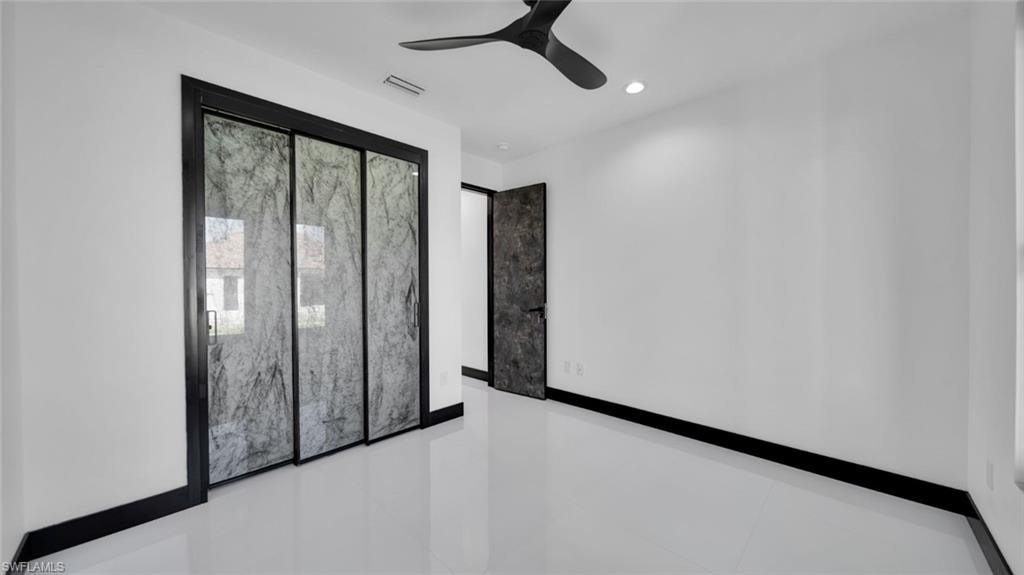 Empty room featuring recessed lighting and ceiling fan