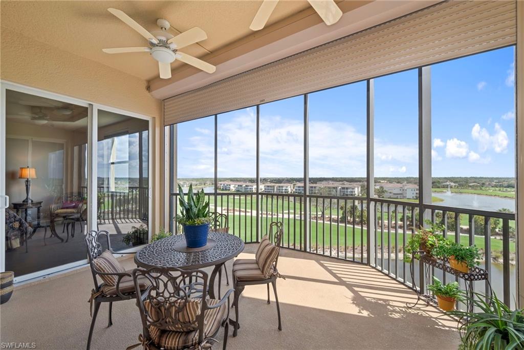Balcony with ceiling fan and a water view