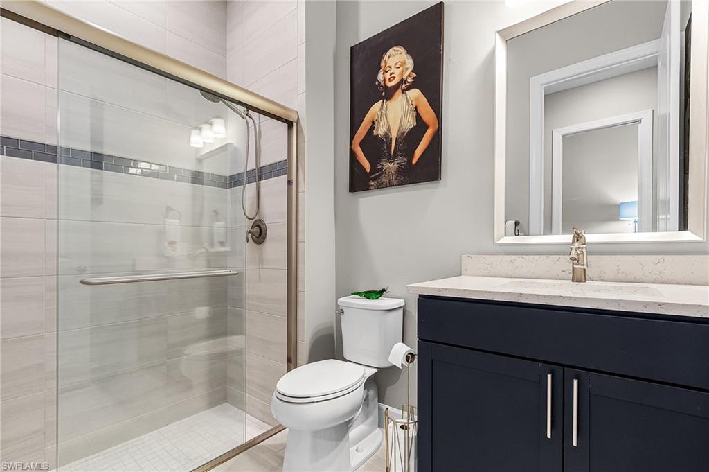 Bathroom with vanity and a stall shower