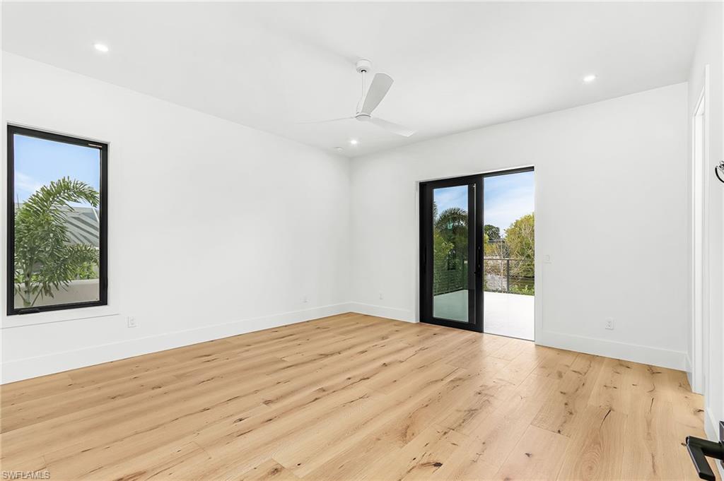 Unfurnished room with ceiling fan, light wood-style floors, and recessed lighting