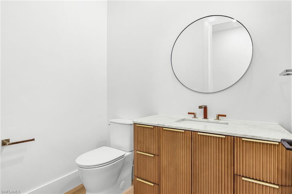 Bathroom with vanity and light wood finished floors