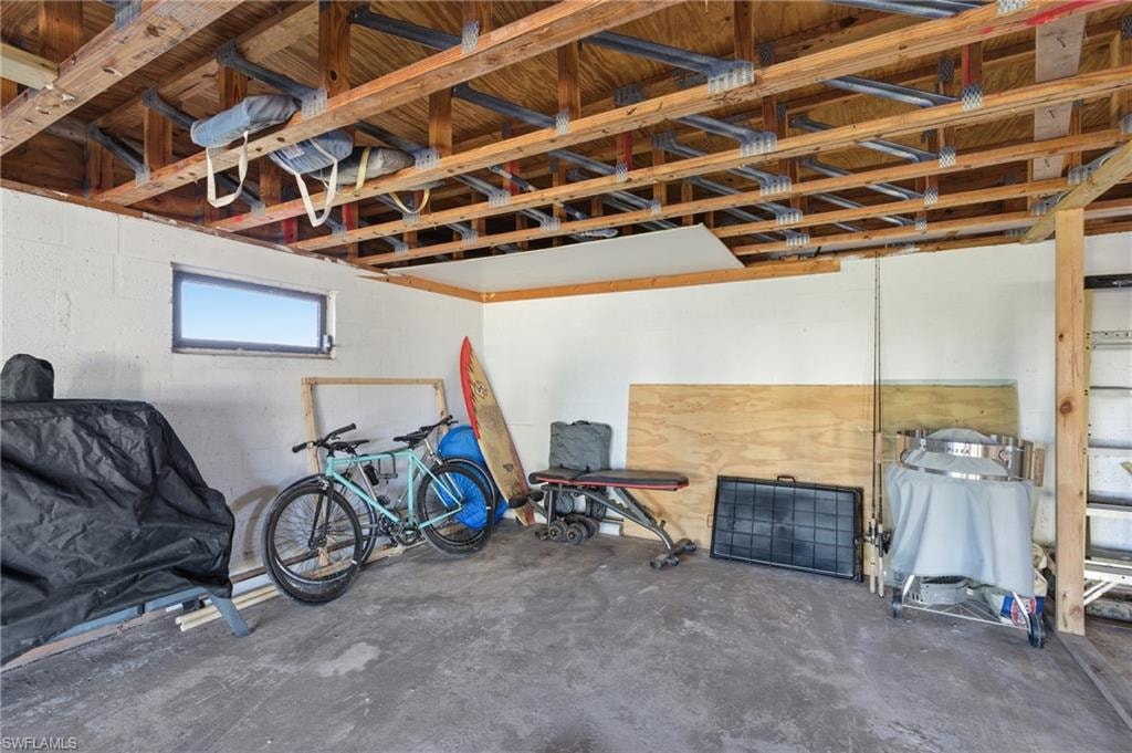 Misc room featuring washer and clothes dryer and concrete floors