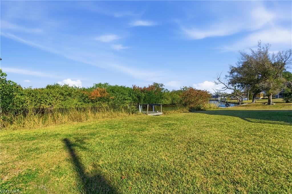 View of grassy yard featuring a water view
