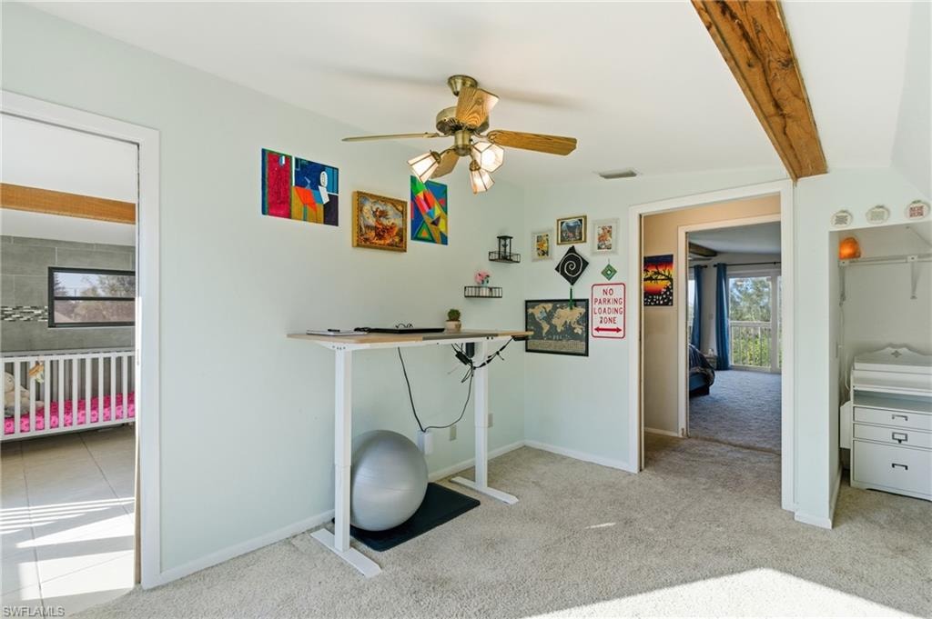 Bedroom with carpet floors, beamed ceiling, ceiling fan, access to exterior, and a closet