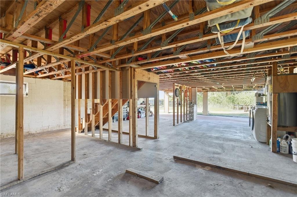 Miscellaneous room featuring concrete floors and washer / clothes dryer