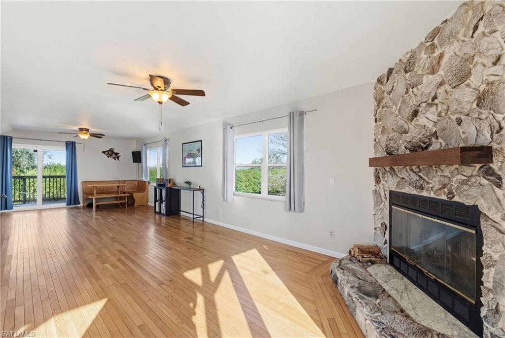 Sitting room featuring ceiling fan and light wood-style floors