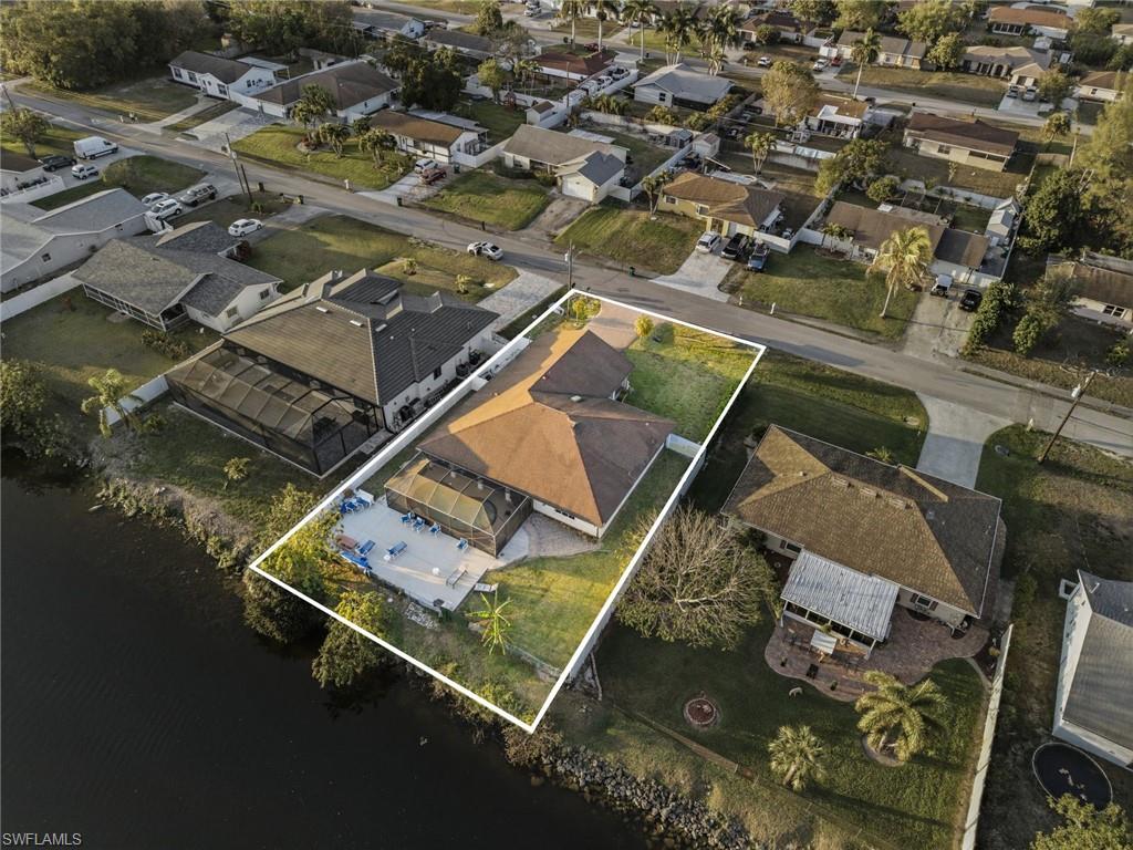 Aerial perspective of suburban area with property boundaries highlighted