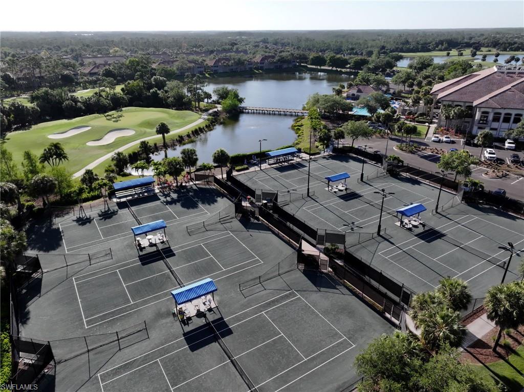 Drone / aerial view with a water view and golf course view