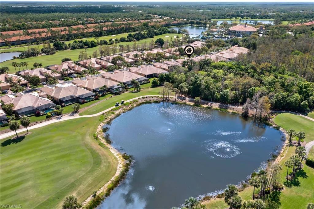 Aerial view with view of golf course, a water view, and a residential view