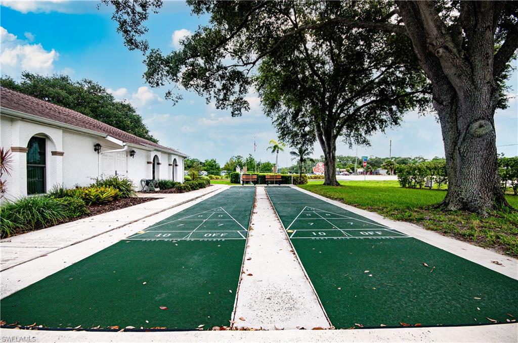 View of home's community featuring shuffleboard