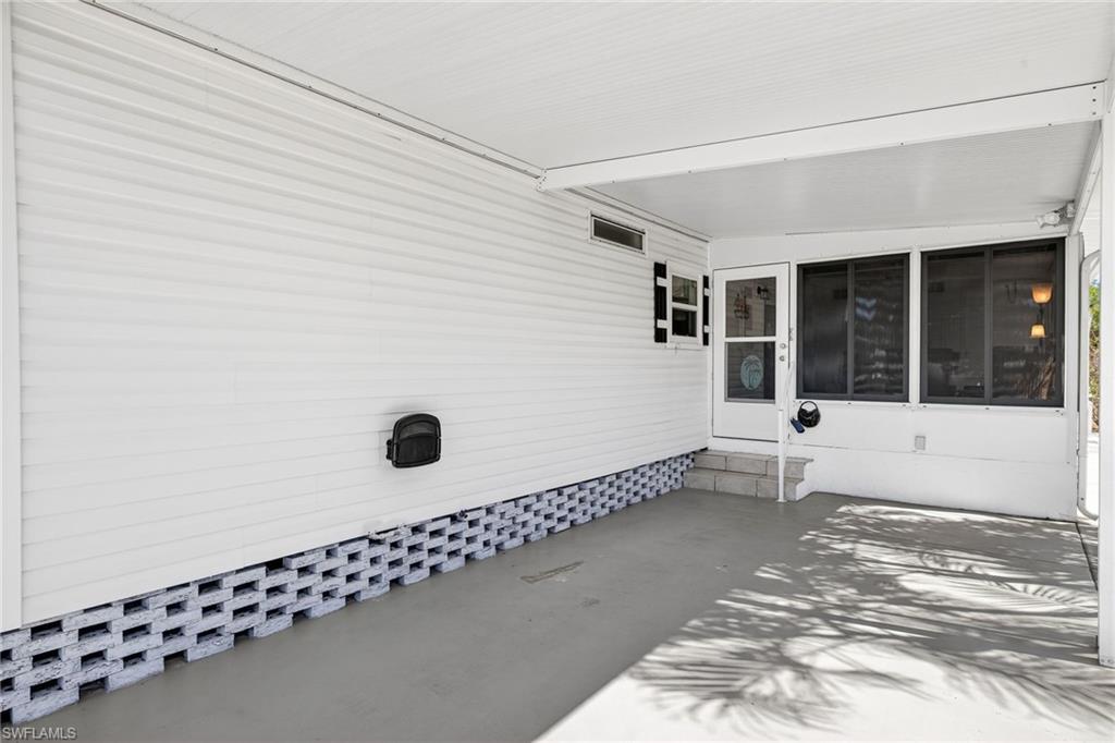 View of patio featuring an attached carport