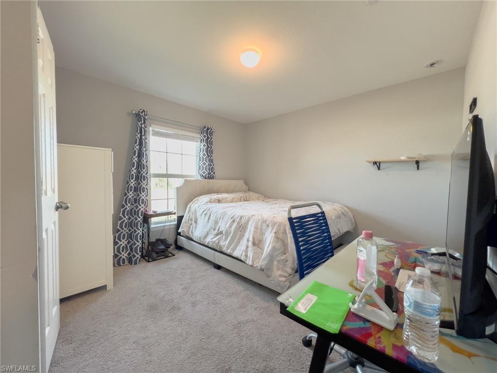 Bedroom with carpet flooring