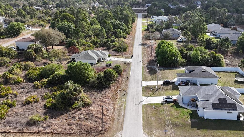Aerial view of residential area with a tree filled landscape