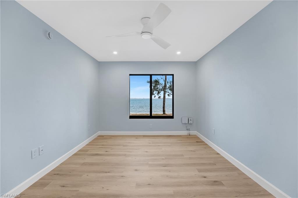 Wake up to tranquil bay views from the comfort of the primary suite.