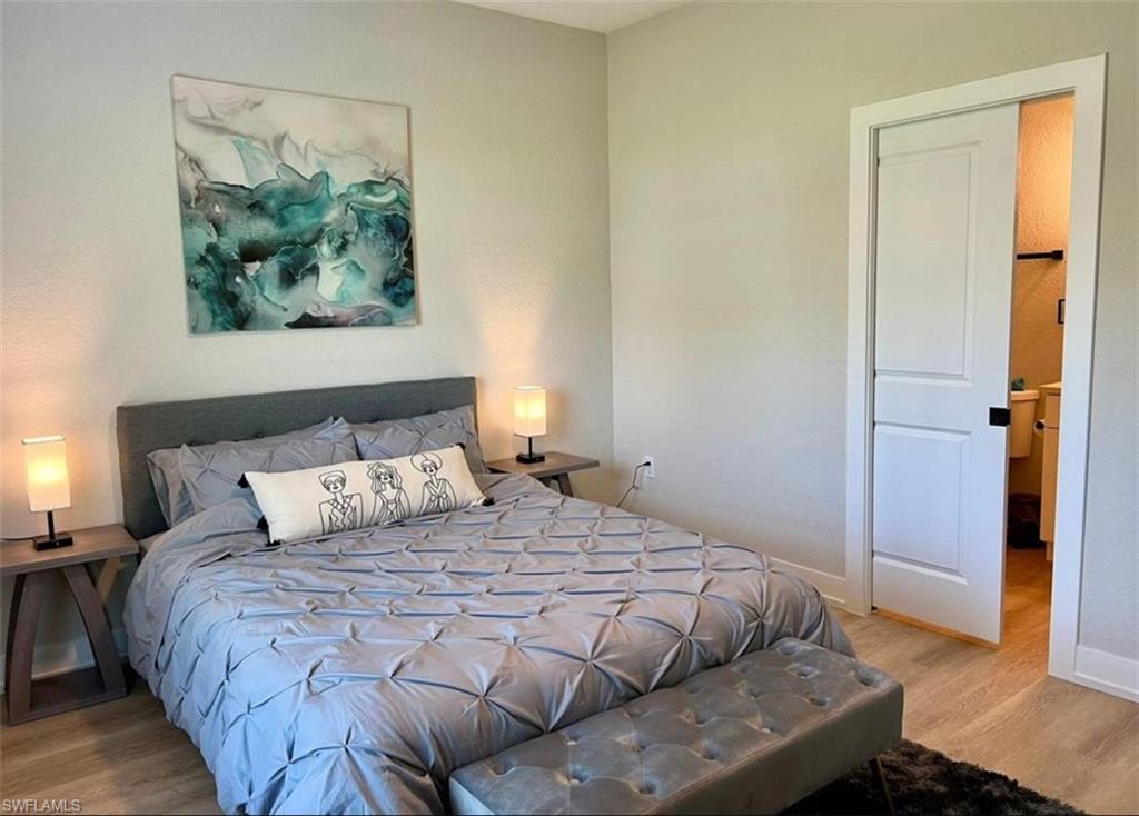 Bedroom with light wood-style floors