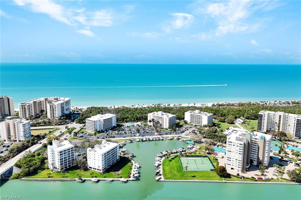 Bird's eye view of a large body of water and apartment complex