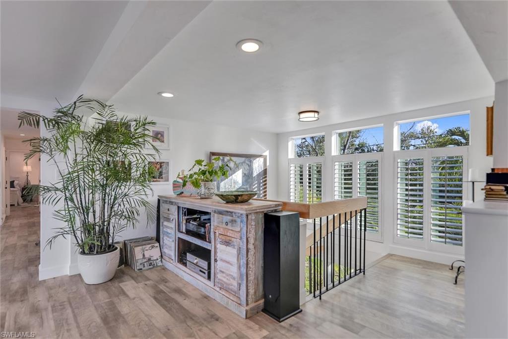 Kitchen with light wood-type flooring and recessed lighting