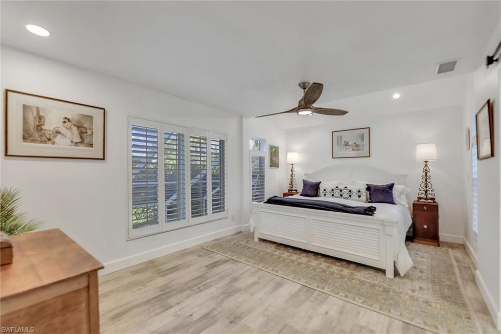Bedroom with recessed lighting, a ceiling fan, and light wood-type flooring