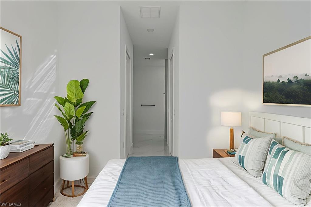 Bedroom featuring ensuite bath and recessed lighting