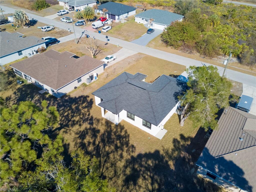 Aerial overview of property's location featuring nearby suburban area