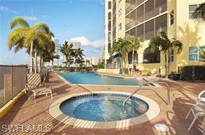 Community pool with a hot tub