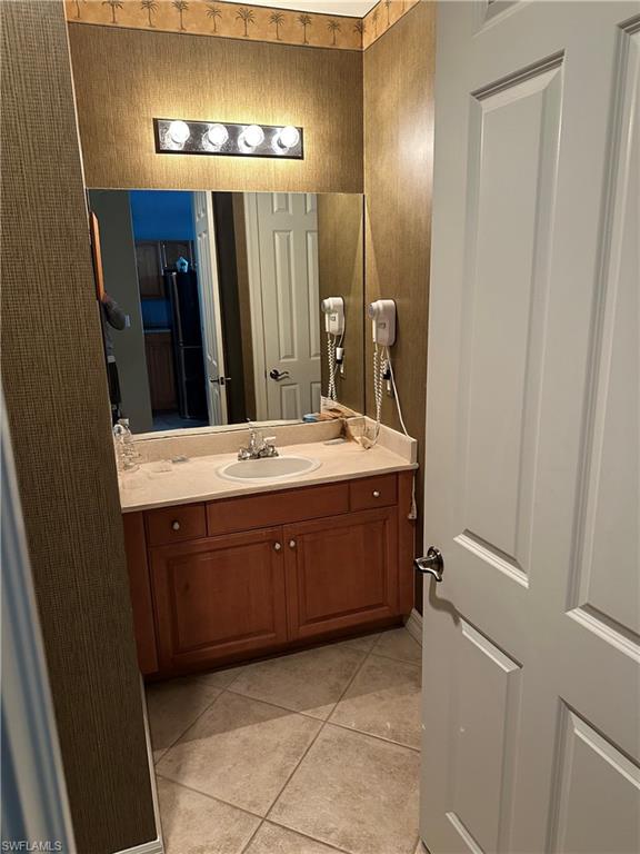 Bathroom featuring vanity and light tile patterned floors