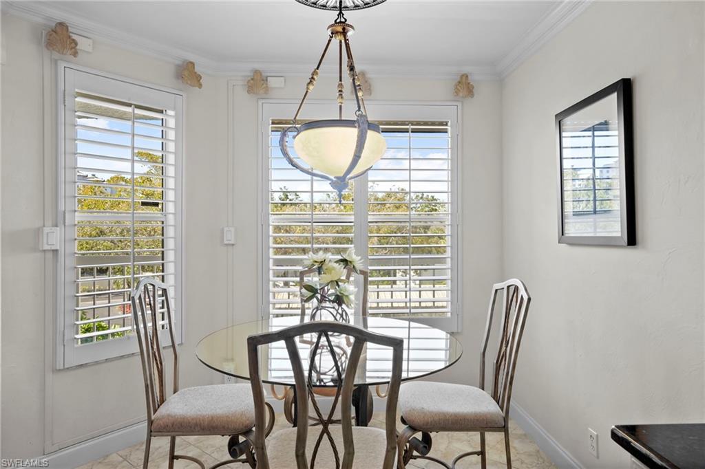 Dining area featuring baseboards and crown molding