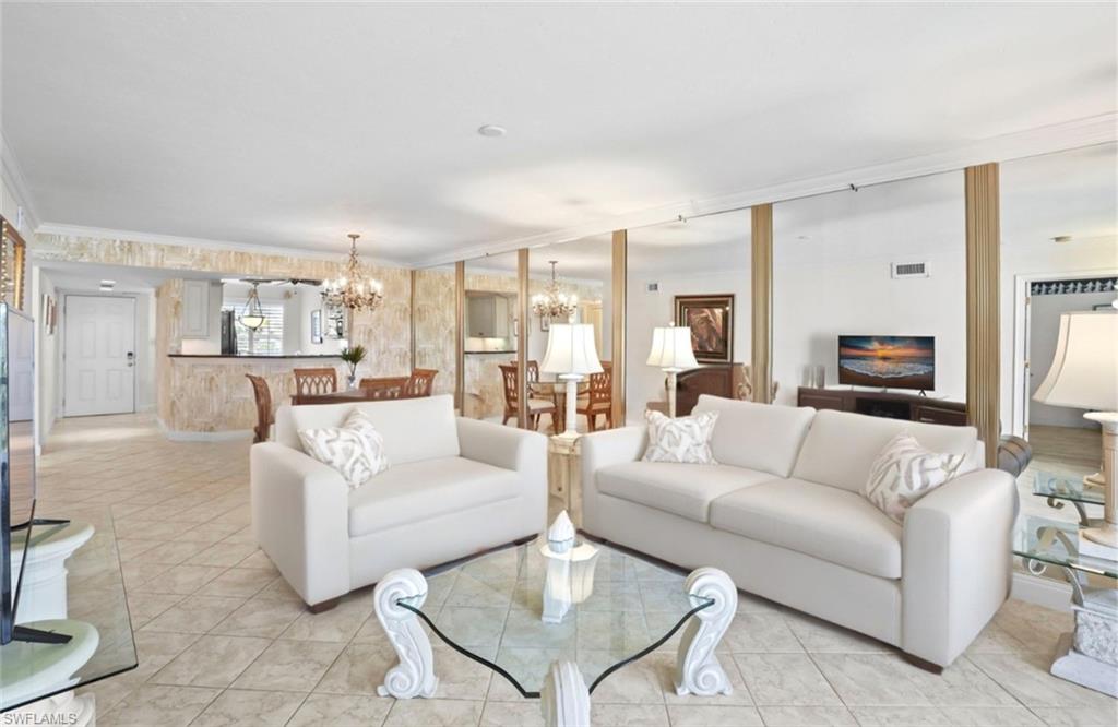 Living room-partial staged-featuring a chandelier and crown molding