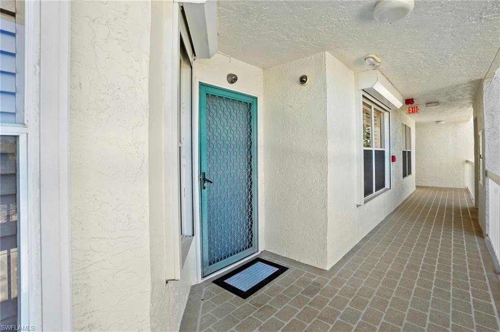 Entrance to property featuring stucco siding