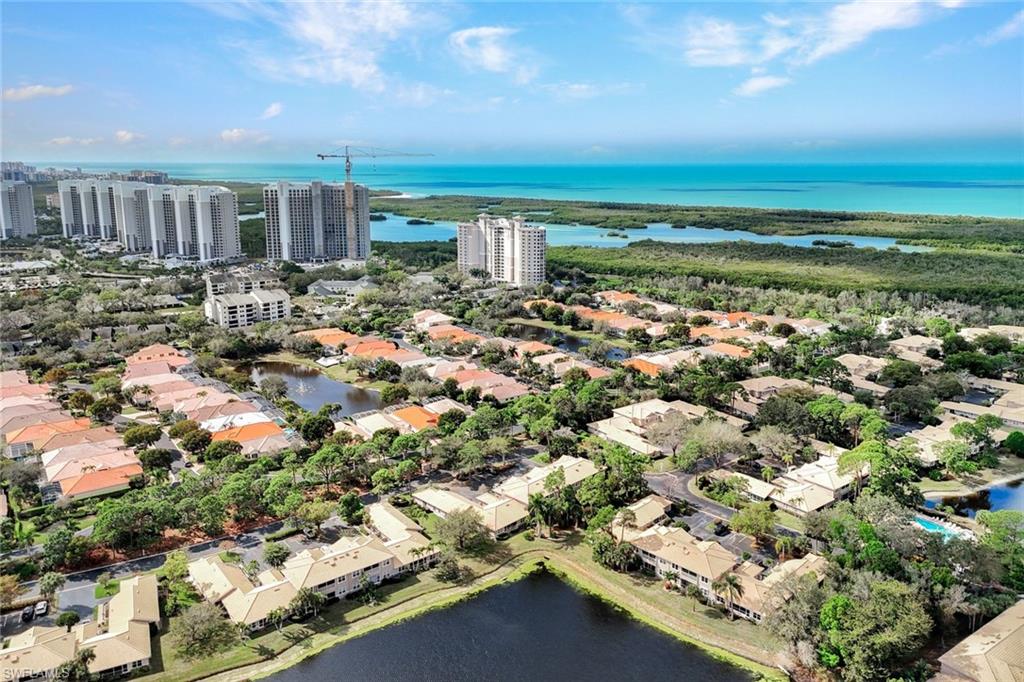 Aerial view of residential area featuring a large body of water