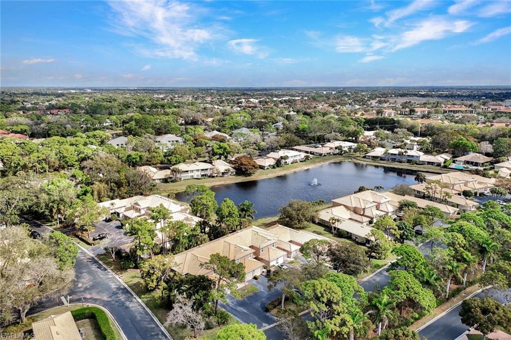 Aerial perspective of suburban area with a large body of water