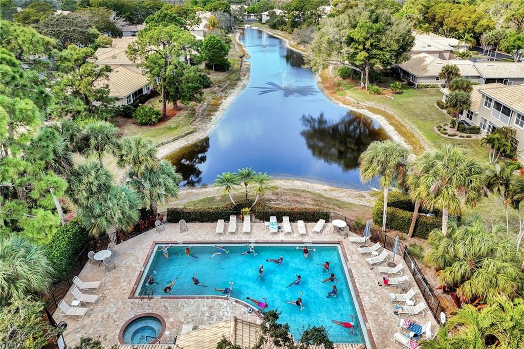 Drone / aerial view of a large body of water and a pool area