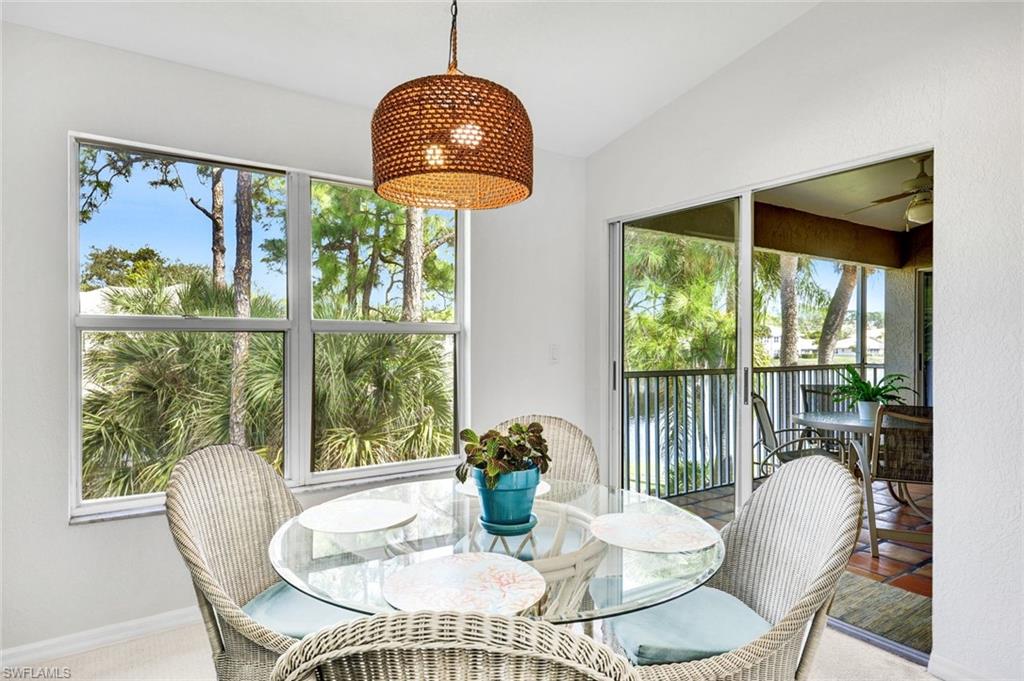 Dining room featuring healthy amount of natural light and lofted ceiling