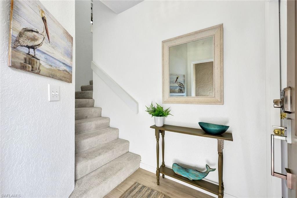 Staircase with wood finished floors