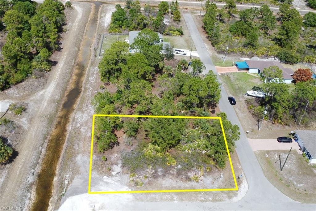 Aerial view of property's location featuring property parcel outlined