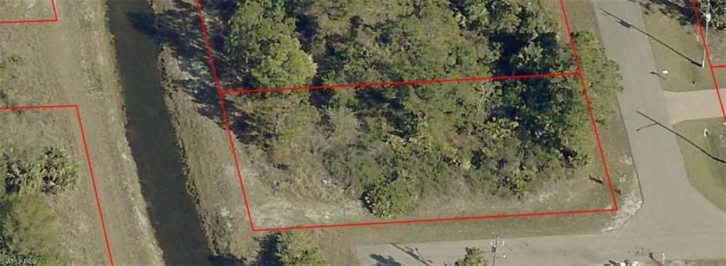 Aerial map of property and surrounding area featuring property parcel outlined