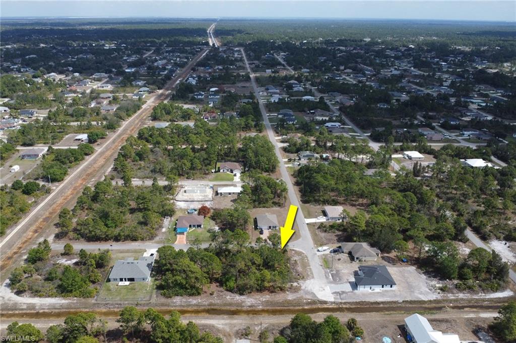 View of property location with nearby suburban area