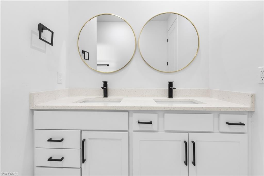 Bathroom featuring double vanity