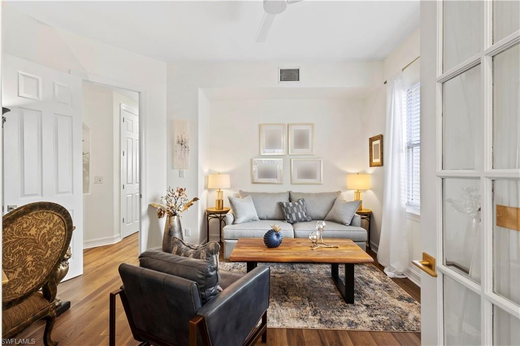 Living room featuring wood finished floors and ceiling fan